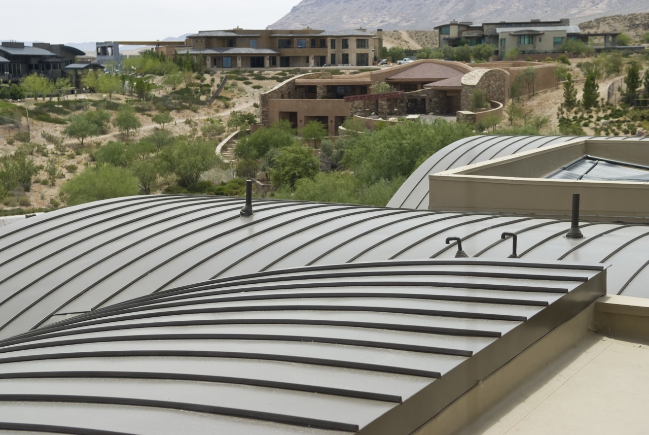 View of the Sun West Custom Home's metal architecture, daylighting, outdoor structure, property, real estate, roof, gray, brown