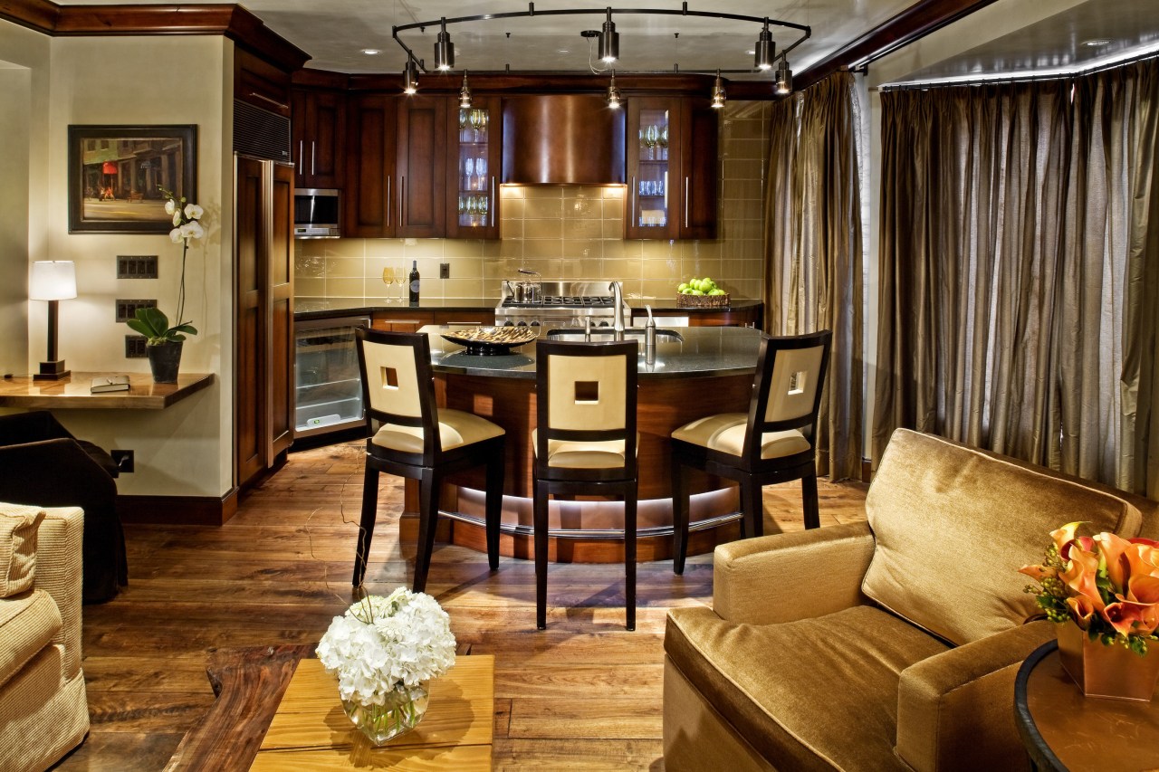 view of a kitchen which features a semi-circular interior design, room, suite, brown