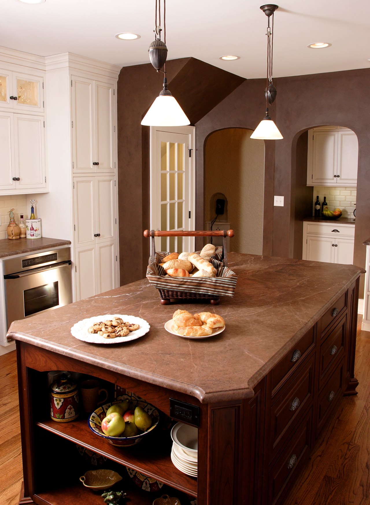 view of a kitchen designed and built by cabinetry, countertop, cuisine classique, dining room, furniture, hardwood, interior design, kitchen, room, table, brown, white