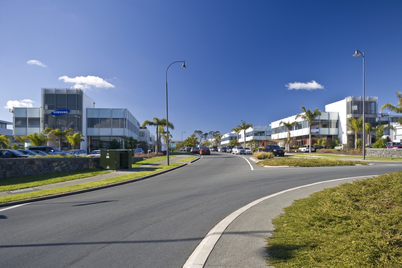 external view of inteplex@albany developed by northbridge properties. area, asphalt, car, city, daytime, downtown, house, infrastructure, lane, metropolitan area, neighbourhood, real estate, residential area, road, sky, street light, suburb, town, tree, urban area, teal