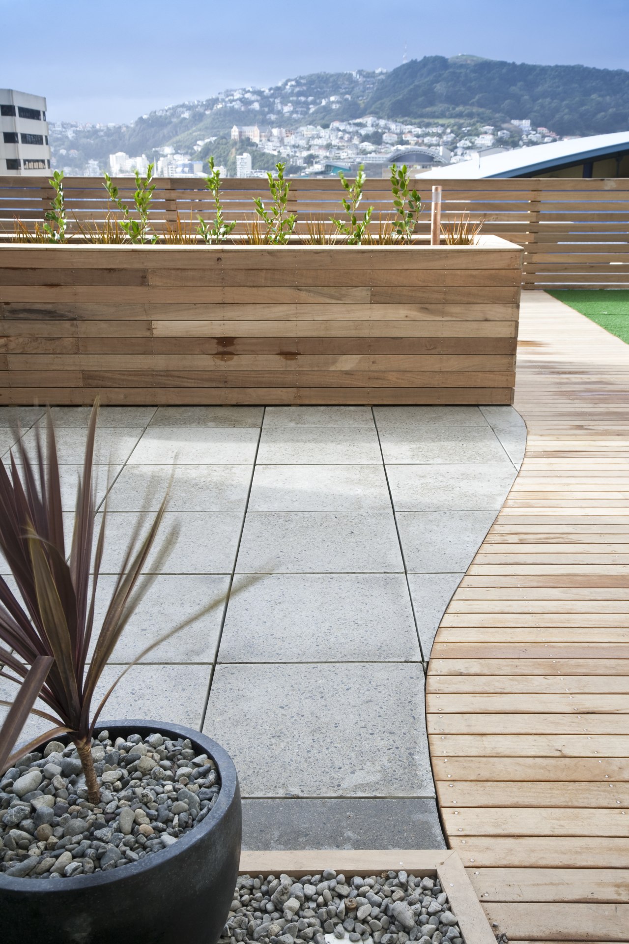 external view of paving on the apartment balconies deck, floor, flooring, hardwood, house, outdoor structure, walkway, wood, gray