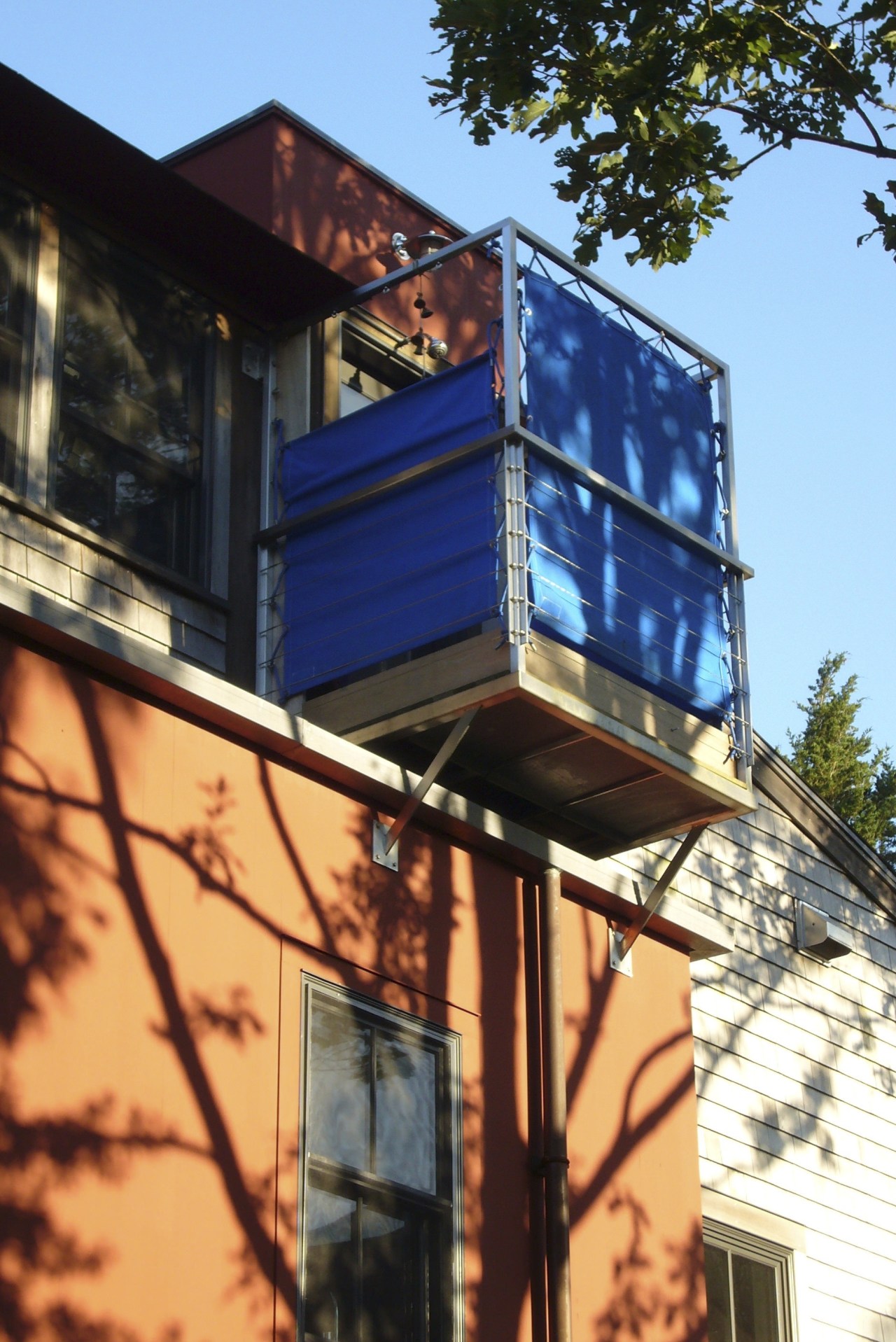 Exterior view of this home which features an architecture, building, daylighting, facade, home, house, residential area, roof, siding, sky, tree, window