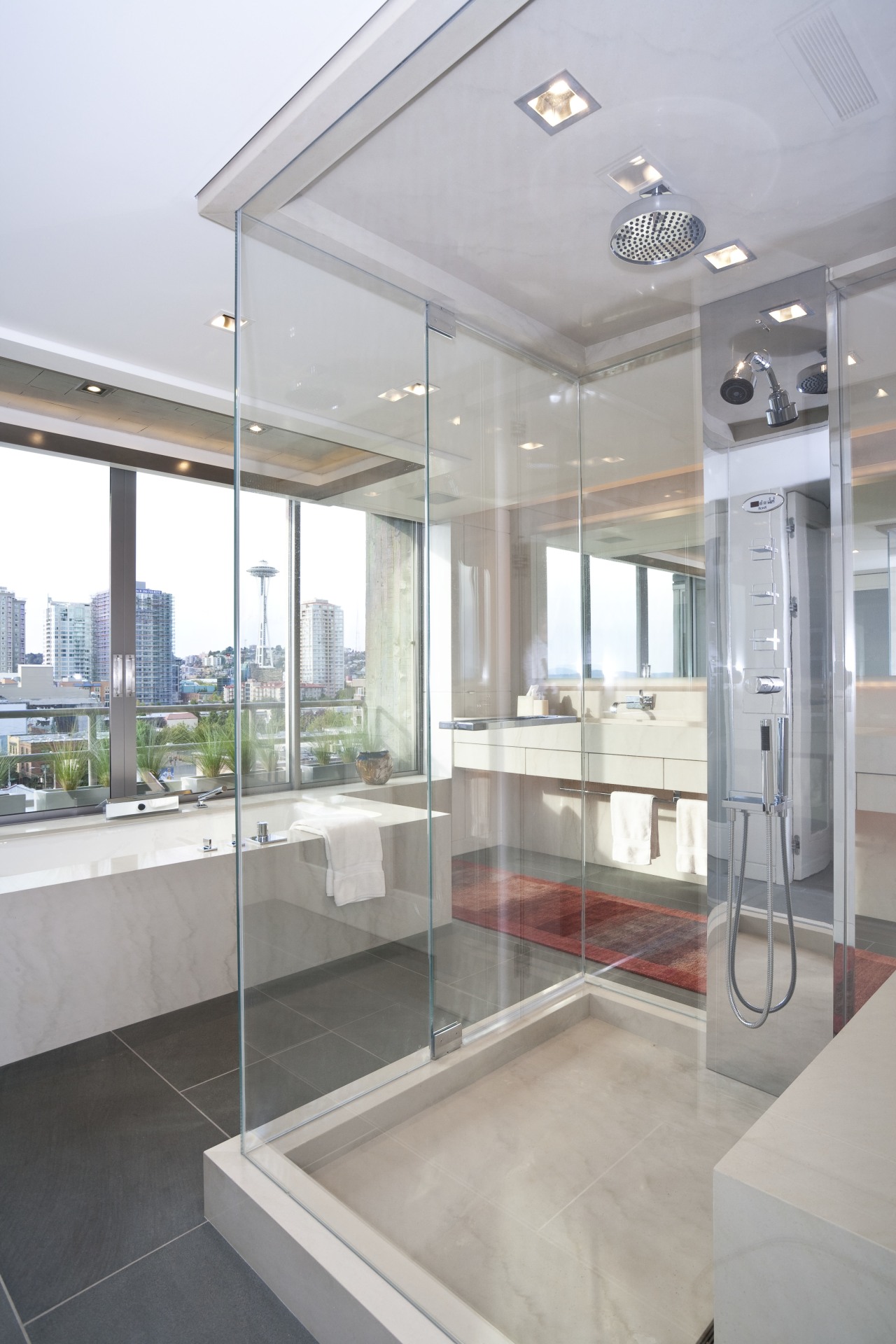 View of a bathroom which features glass shower bathroom, interior design, real estate, sink, window, gray