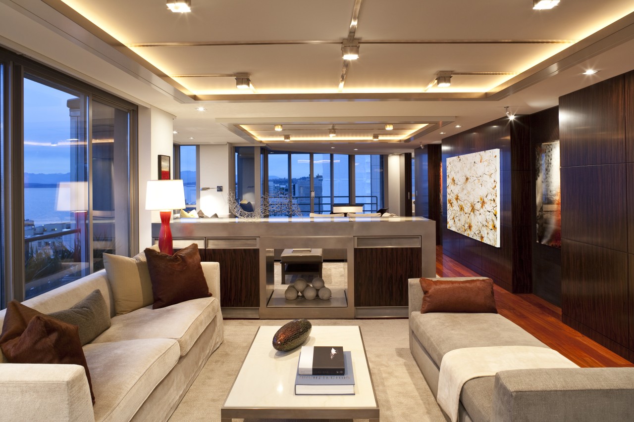 View of living space featuring rosewood flooring, customized ceiling, interior design, living room, real estate, room, orange, brown