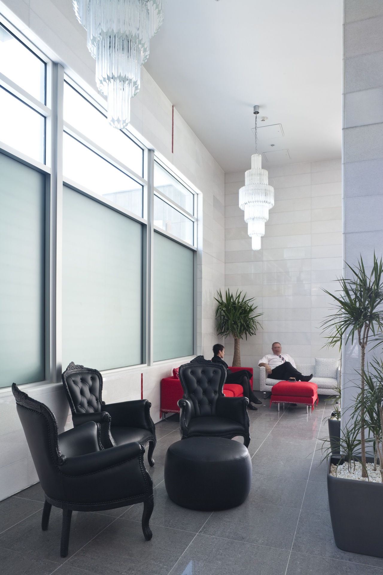 The office interiors at the Club Tower reflect architecture, ceiling, floor, furniture, home, house, interior design, living room, window, white, gray