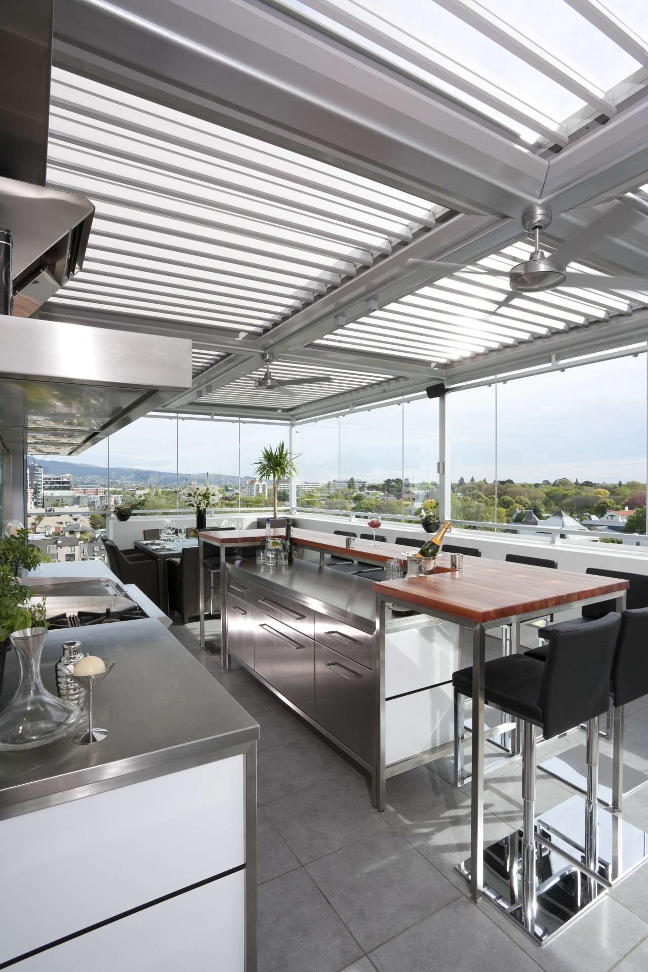 The commercial look of the kitchen is reinforced daylighting, interior design, real estate, roof, white, gray