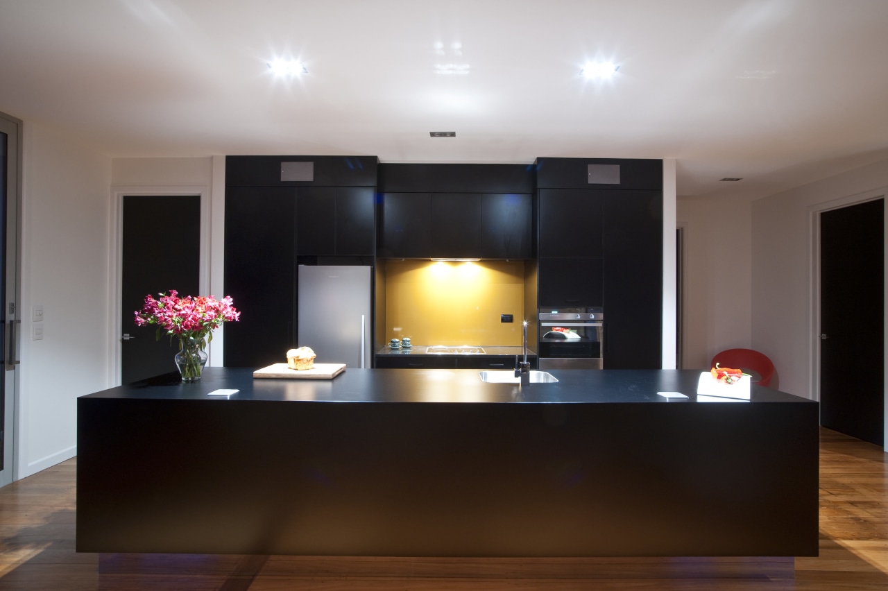 This new kitchen designed by Nicola Mason of ceiling, flooring, furniture, interior design, lighting, real estate, room, table, gray, black, brown