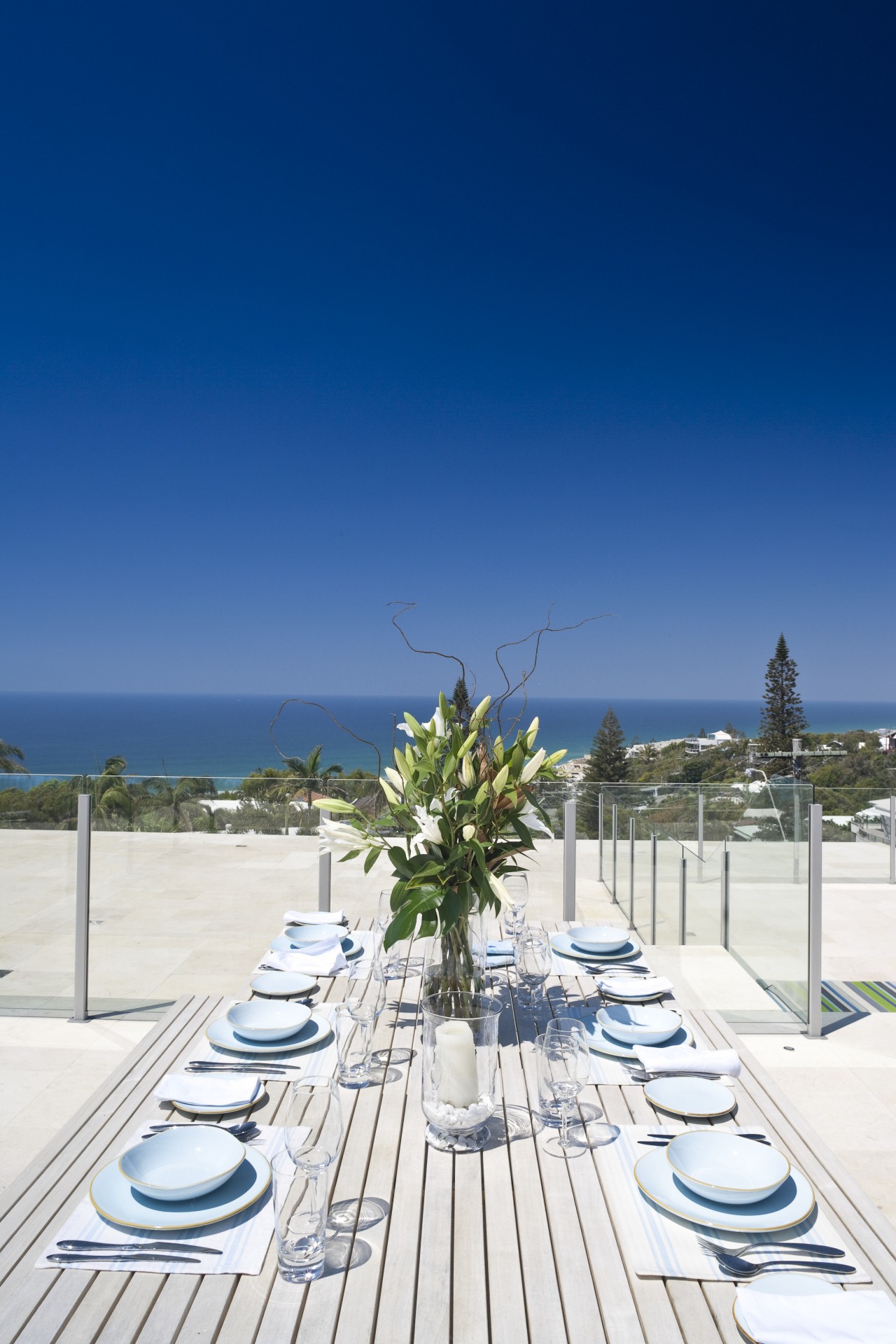 View of rooftop terrace which features paving, outdoor leisure, real estate, resort, sea, sky, swimming pool, vacation, blue, white