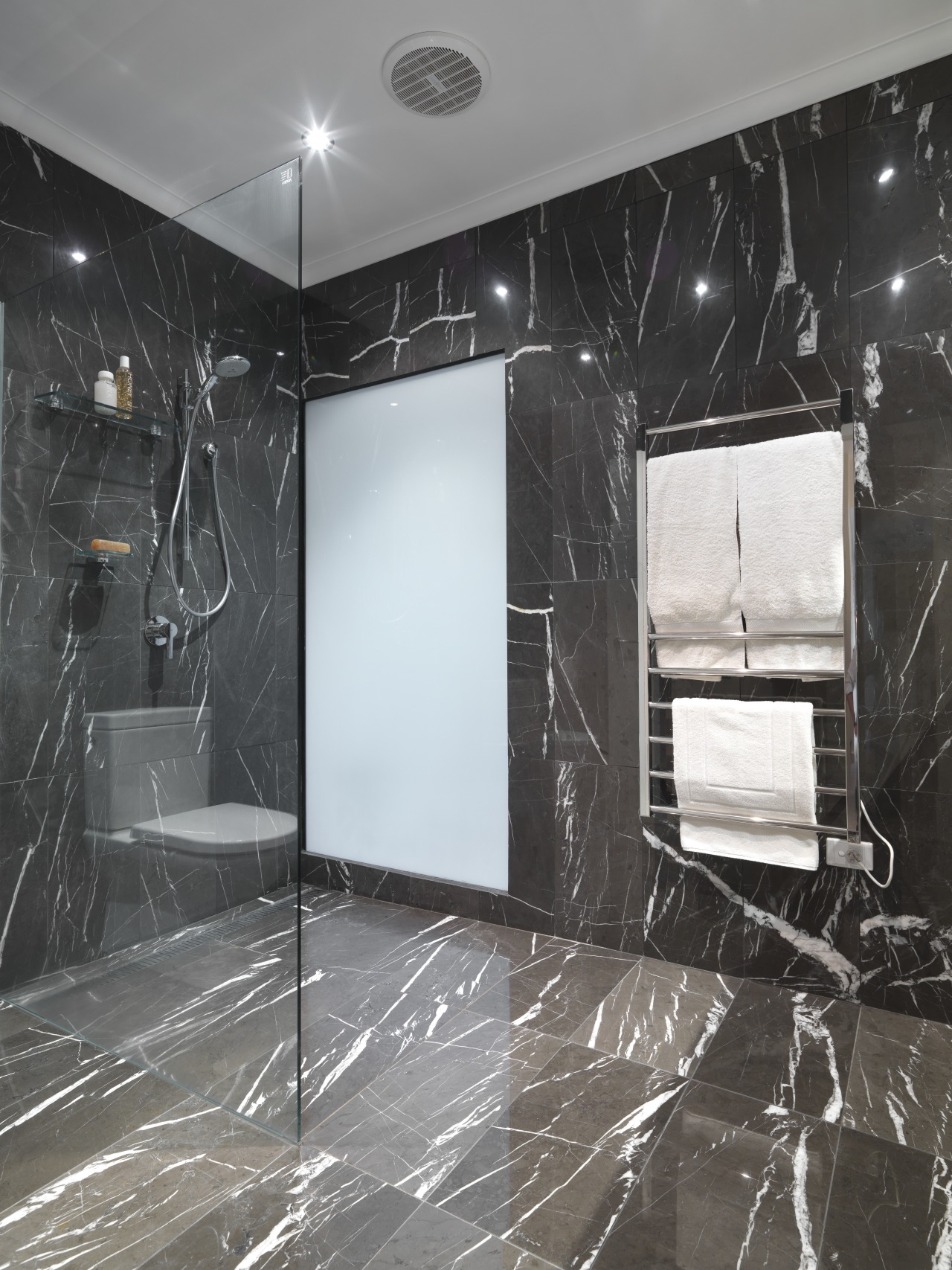 View of bathroom which features chocolate-coloured marble floor bathroom, ceiling, floor, flooring, glass, interior design, room, tile, wall, black, gray