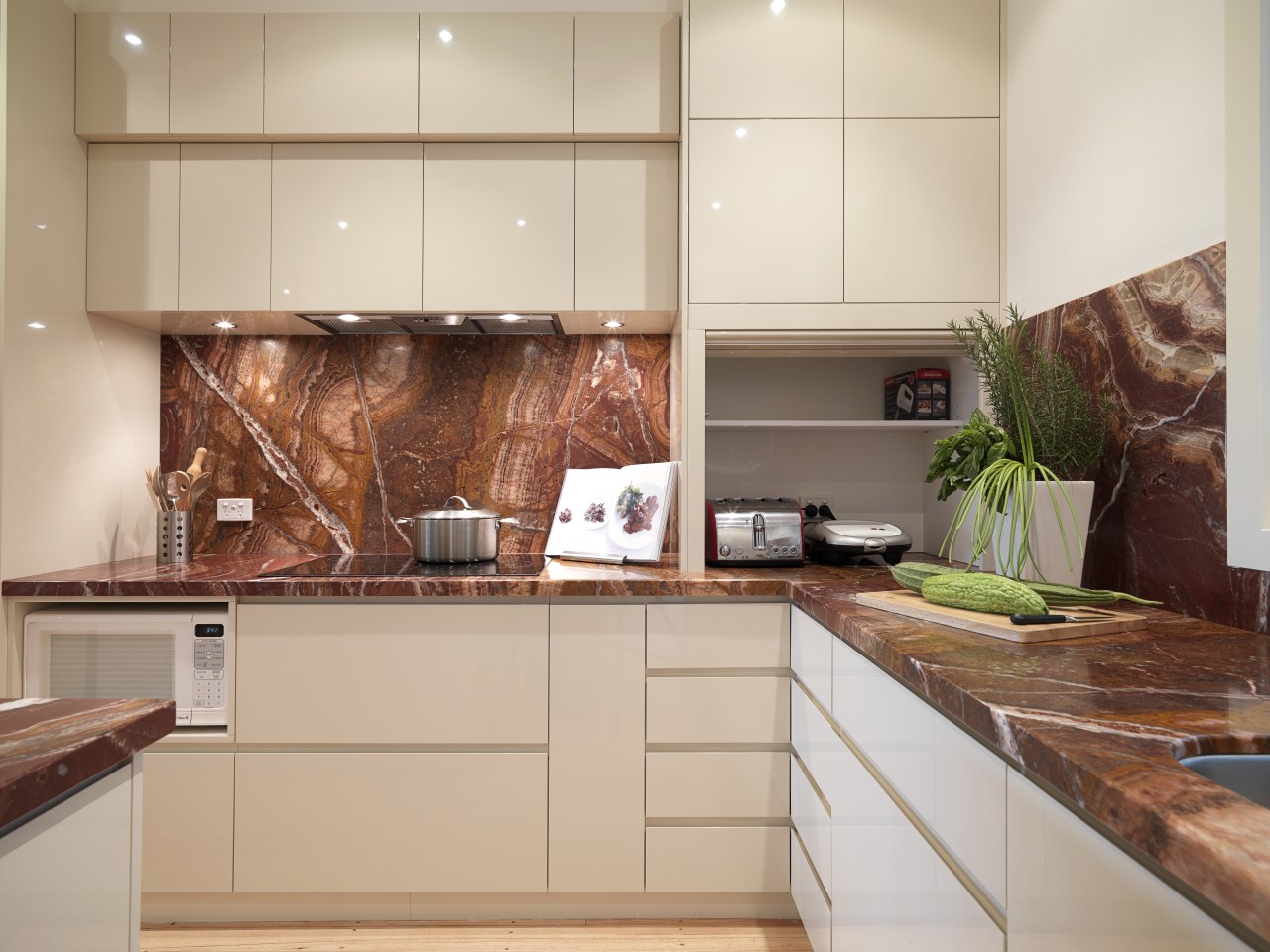 View of contemporary kitchen with light wooden flooring, cabinetry, countertop, interior design, kitchen, gray