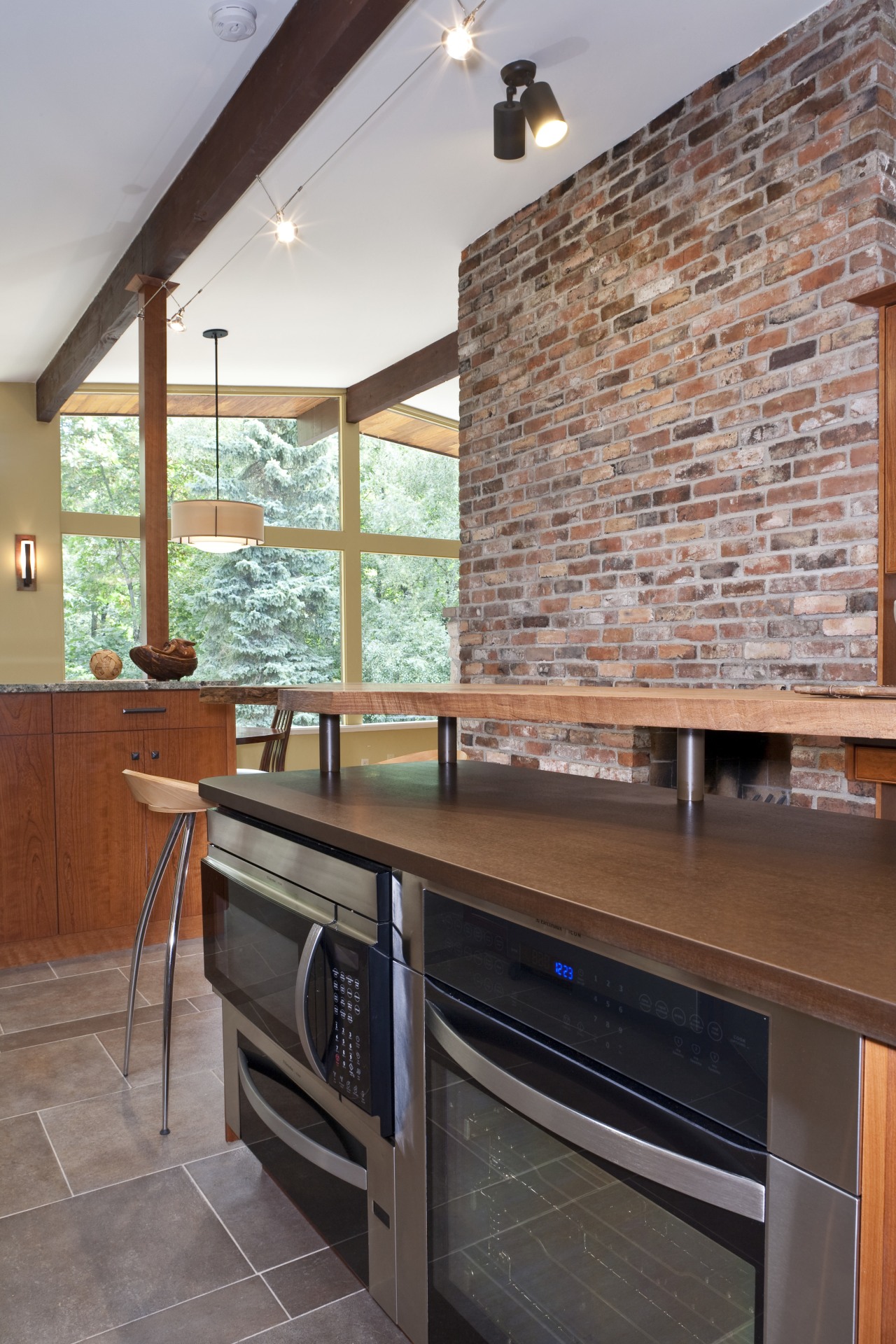 View of this contemporary kitchen with many accessories cabinetry, countertop, floor, flooring, hardwood, home, interior design, kitchen, real estate, room, gray