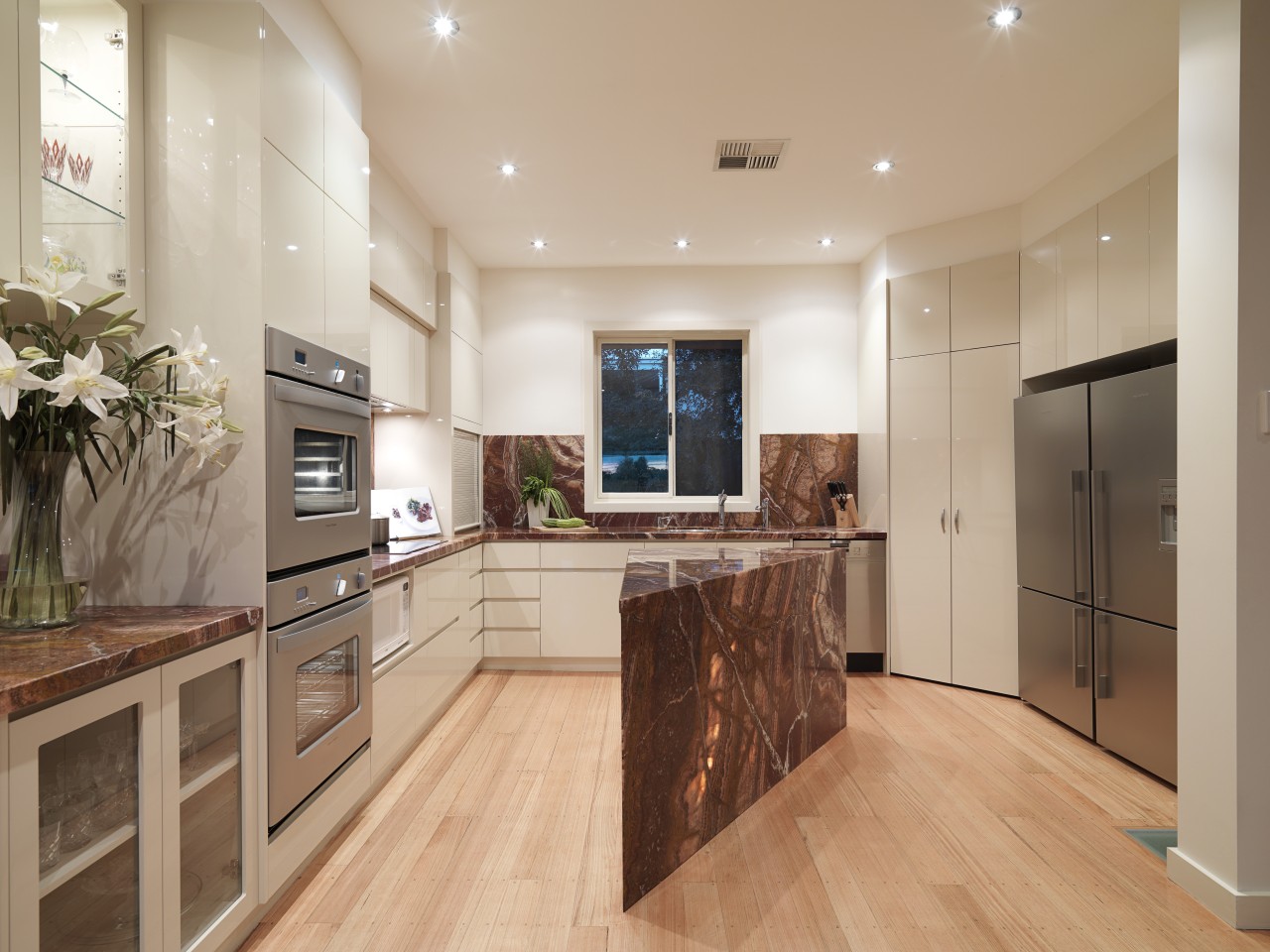 Interior view of this modern kitchen cabinetry, countertop, floor, flooring, hardwood, interior design, kitchen, laminate flooring, property, real estate, room, wood flooring, orange, gray, brown