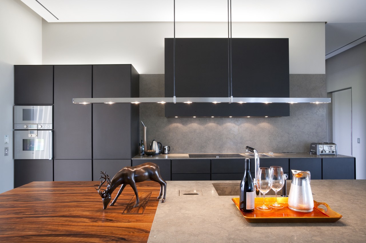 View of a contemporary kitchen which features island, interior design, kitchen, product design, gray