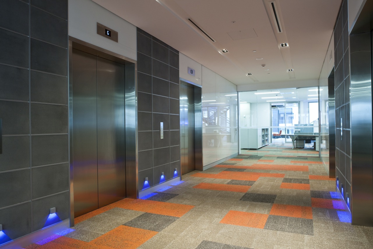 View of the elevator lobby at the Deloitte architecture, ceiling, floor, flooring, glass, interior design, lobby, real estate, black