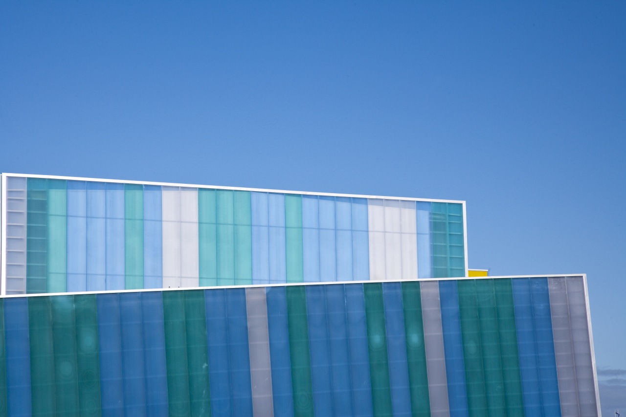 Exterior view of the new extension at the architecture, blue, building, commercial building, corporate headquarters, daylighting, daytime, energy, facade, headquarters, line, sky, structure, teal