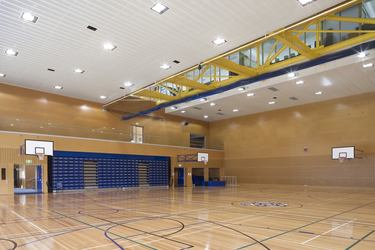 Interior view of the gymnasium of the St basketball court, ceiling, daylighting, floor, flooring, hall, hardwood, interior design, leisure, leisure centre, lobby, sport venue, sports, structure, wood, orange, gray