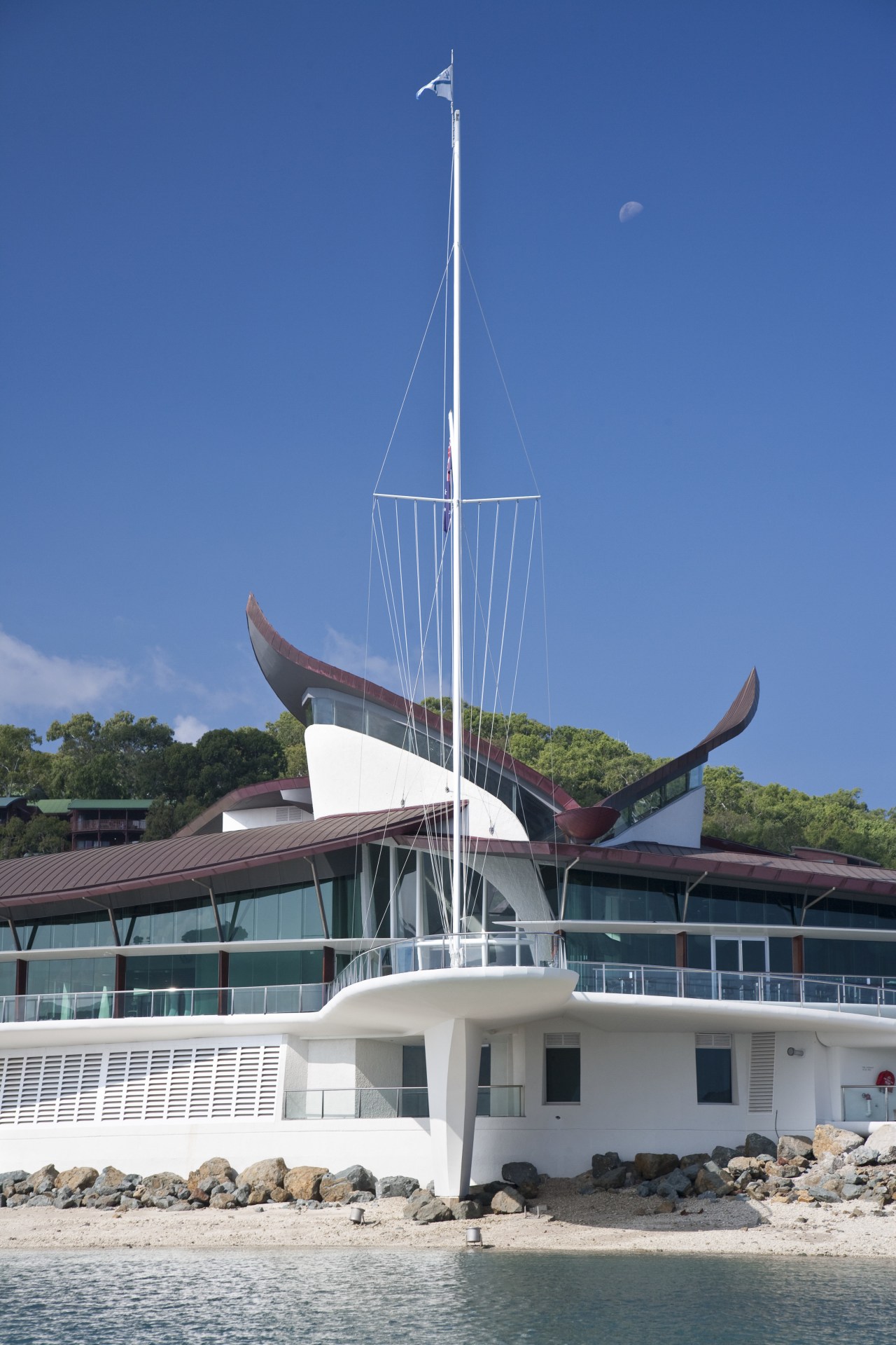 Copper roofing was specified for the yacht club boat, boating, sailboat, sea, sky, water, watercraft, yacht, blue, teal