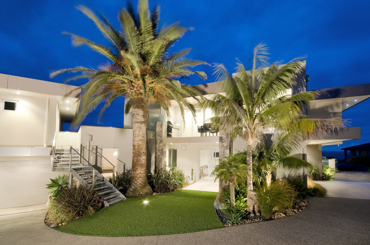 Exterior view of a home designed by Graham arecales, estate, facade, home, house, mansion, palm tree, property, real estate, residential area, resort, sky, villa, brown, blue