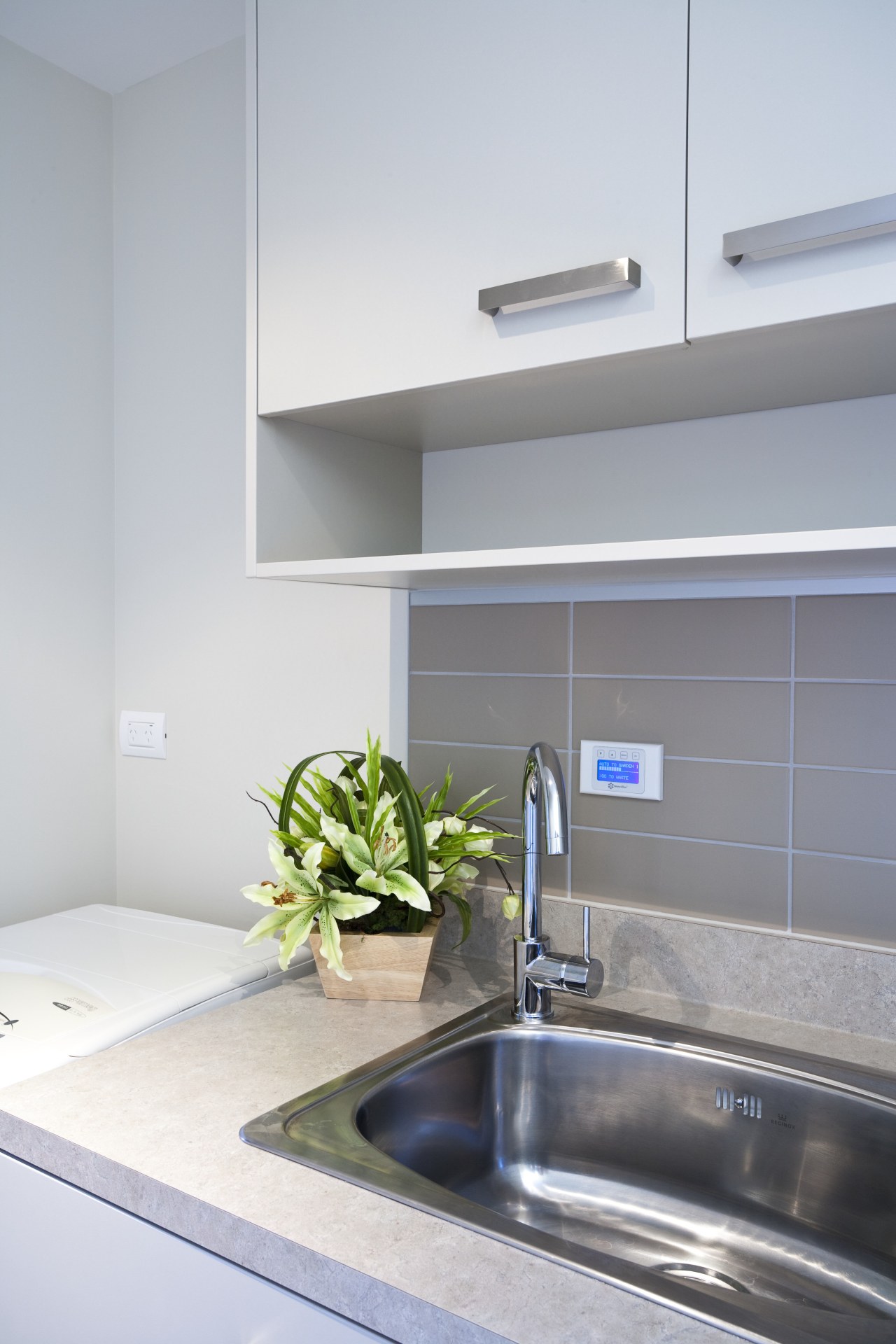 View of the touch-button keypad that controls the bathroom, countertop, interior design, kitchen, room, sink, tap, gray