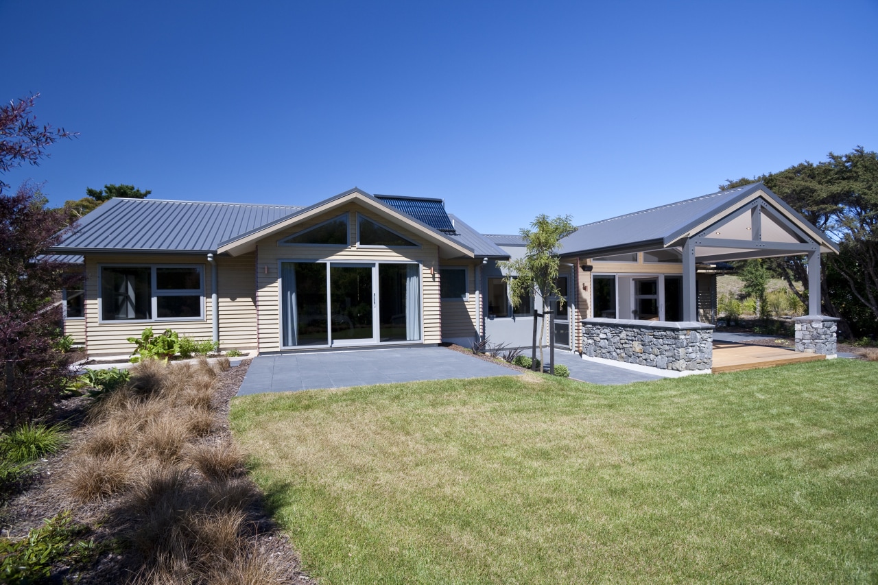 Exterior view of a house built by David backyard, cottage, elevation, estate, facade, farmhouse, home, house, land lot, landscape, property, real estate, residential area, siding, sky, villa, yard