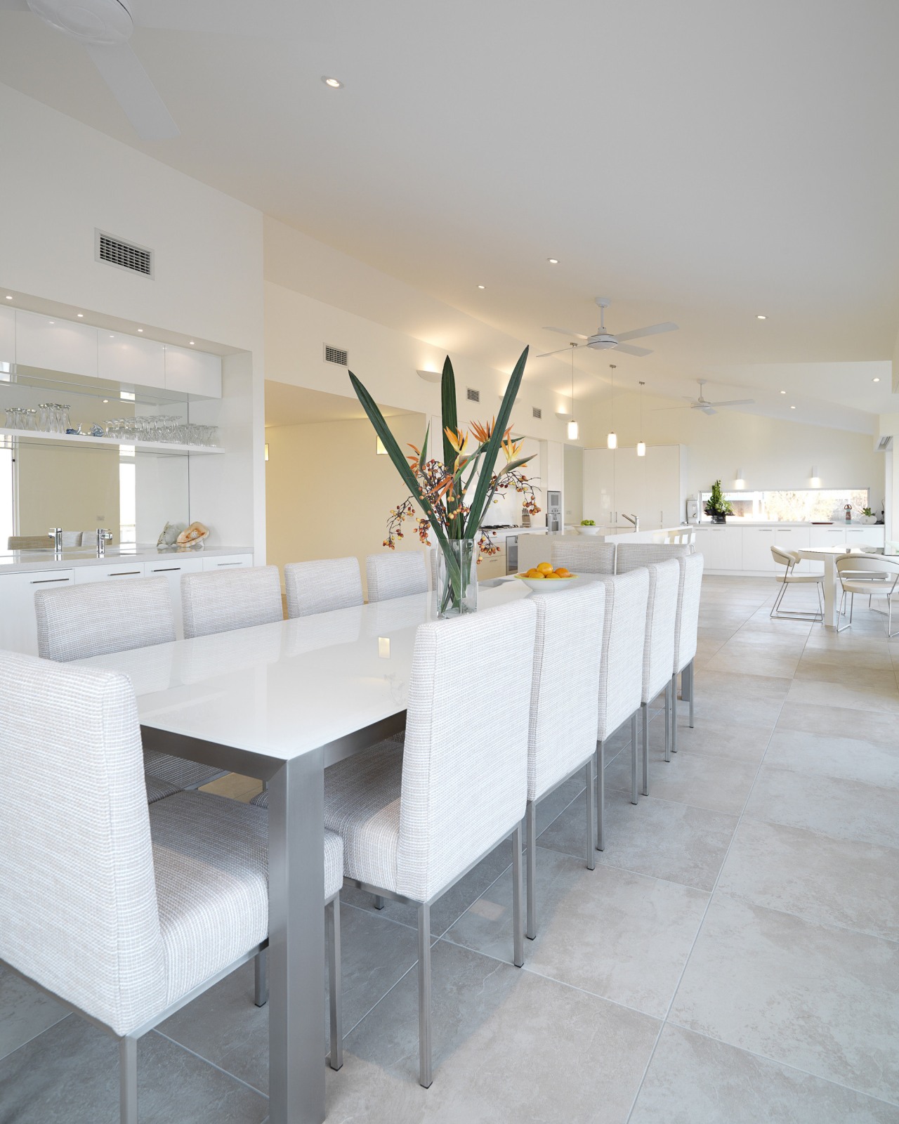 View of dining area which features tiled floors, architecture, floor, furniture, interior design, table, gray