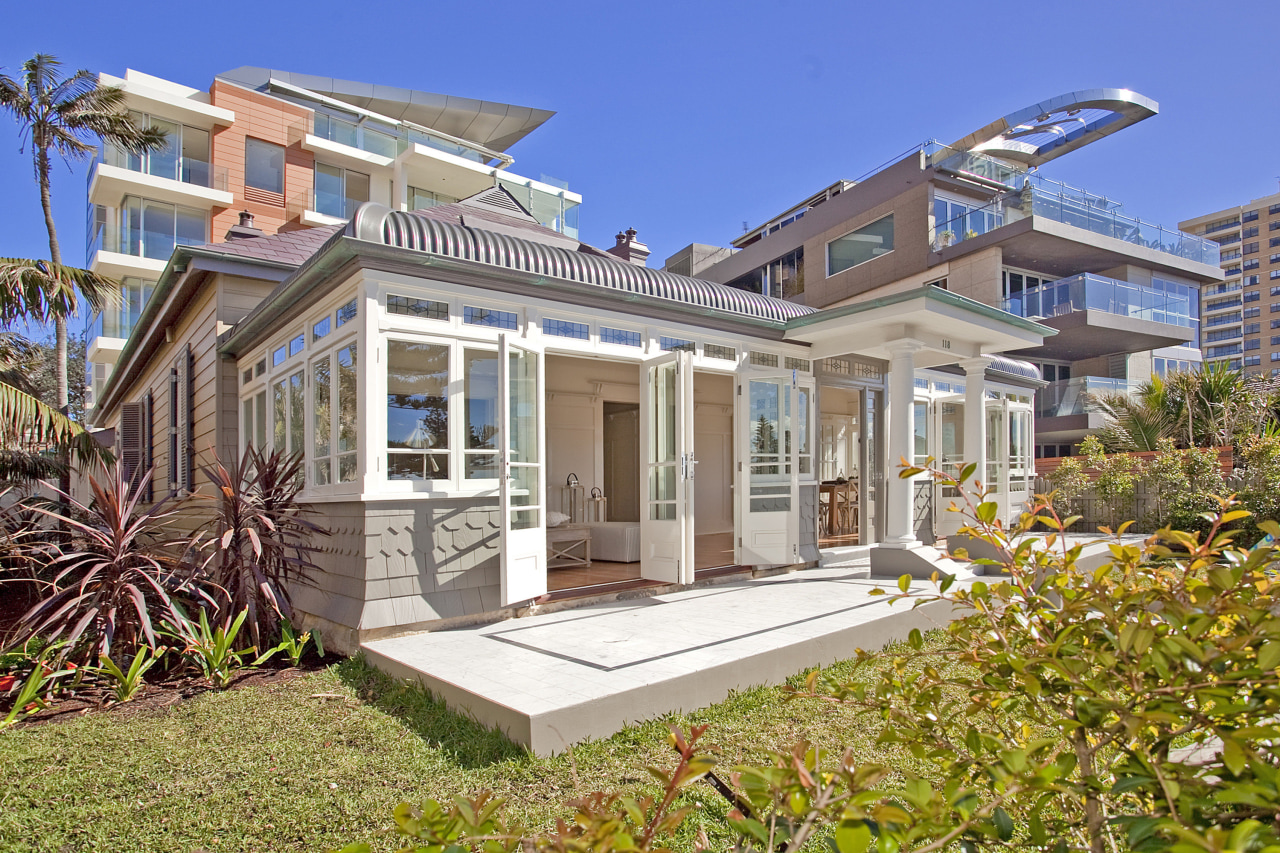 View of beachfront house with courtyard, formal living cottage, elevation, estate, facade, home, house, mansion, property, real estate, residential area, villa, gray