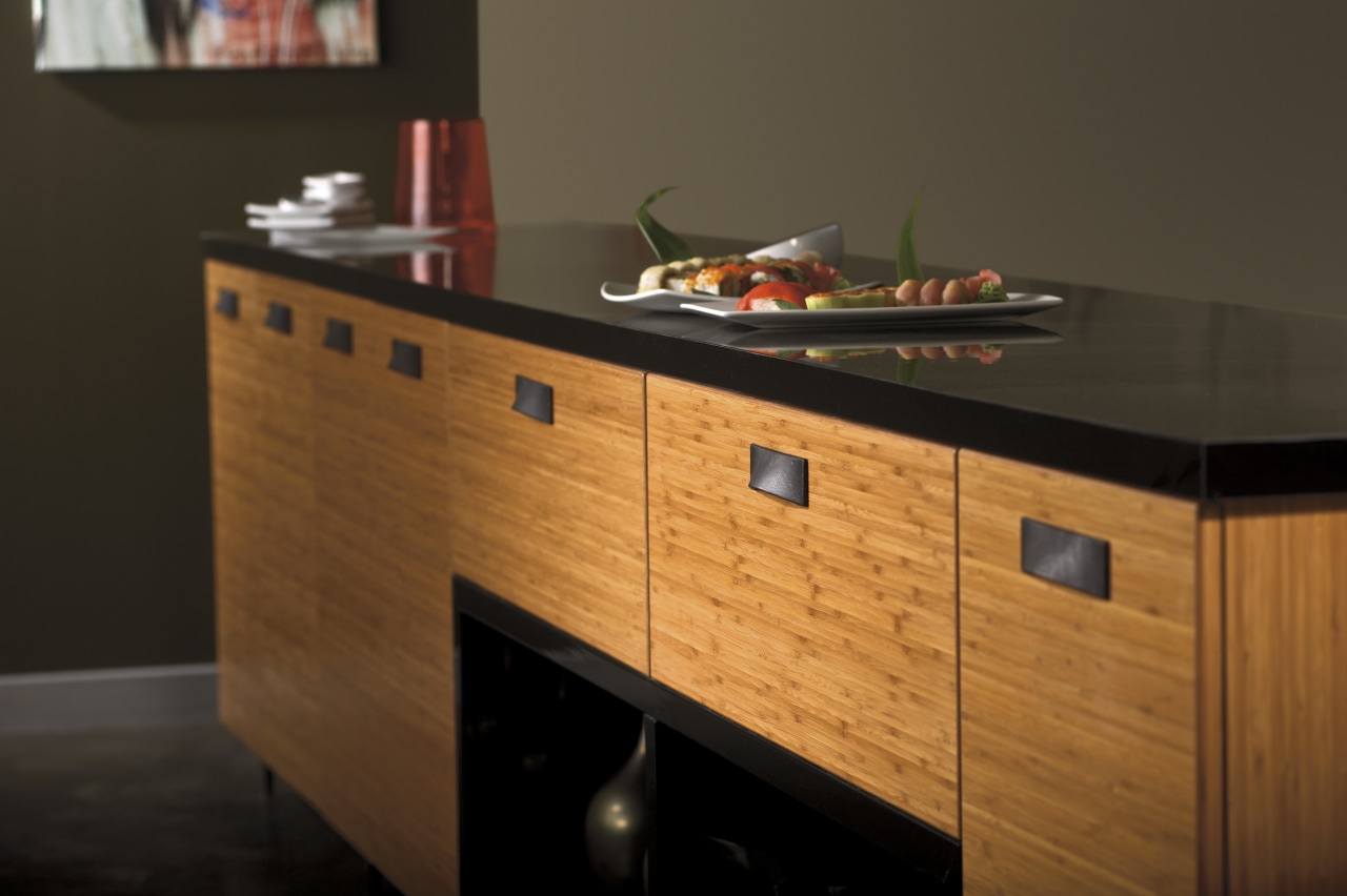 View of a bedroom which features cabinetry from cabinetry, chest of drawers, countertop, drawer, furniture, hardwood, kitchen, sideboard, table, wood, wood stain, black, brown