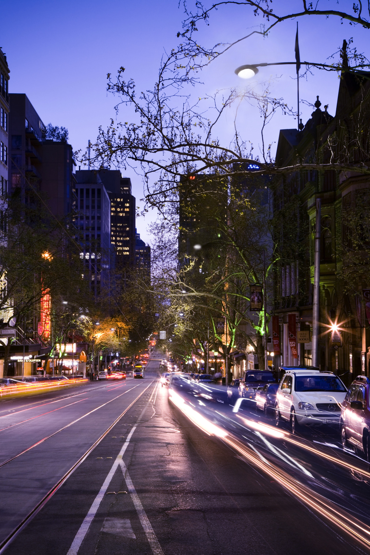 Evening in Collins St architecture, building, car, city, cityscape, daytime, downtown, dusk, evening, house, infrastructure, landmark, lane, light, light fixture, lighting, metropolis, metropolitan area, morning, neighbourhood, night, plant, reflection, residential area, road, sky, skyline, skyscraper, street, street light, suburb, town, traffic, tree, urban area, blue, purple, black