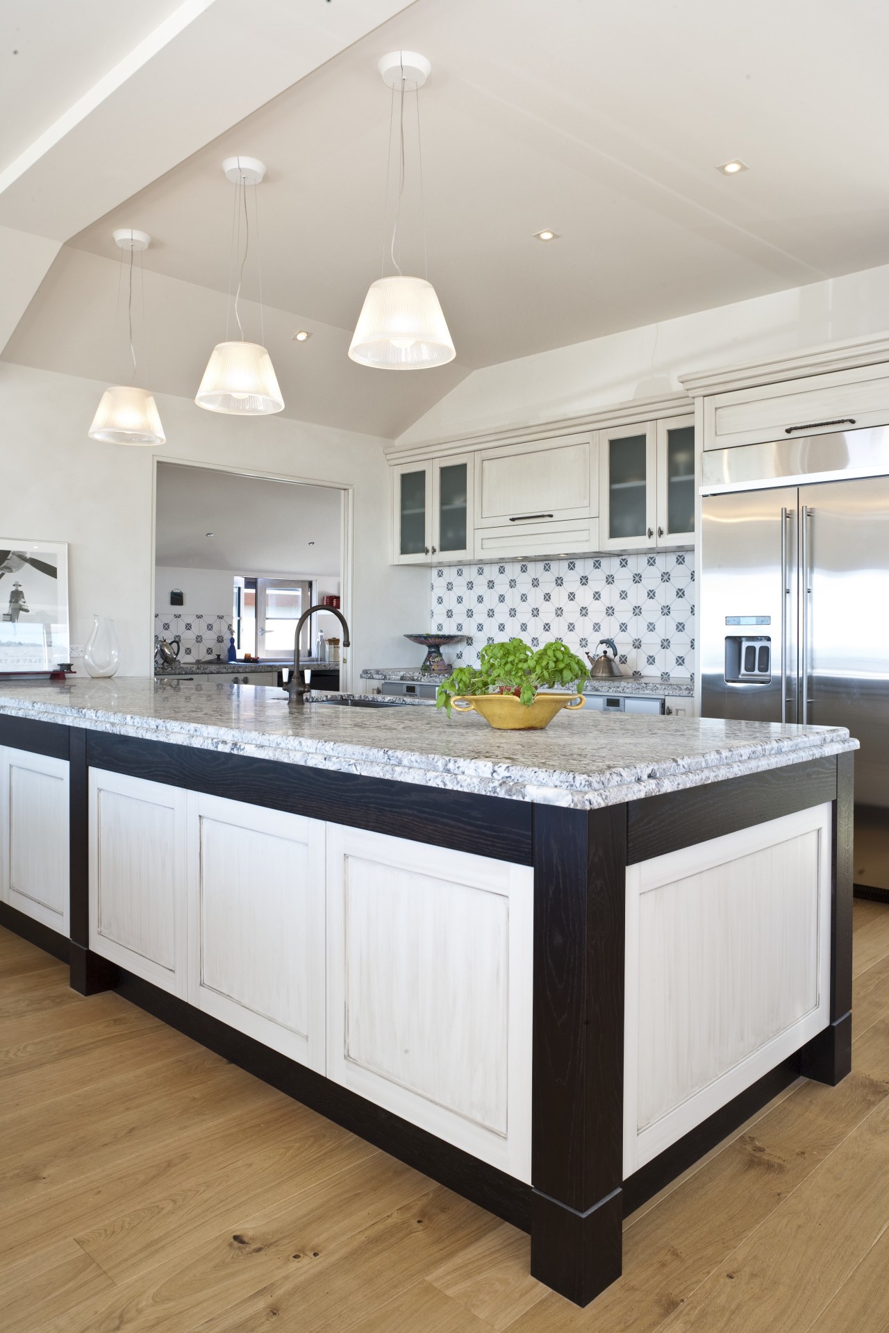 Close-up view of main kitchen area with large cabinetry, countertop, cuisine classique, floor, home, interior design, kitchen, room, white