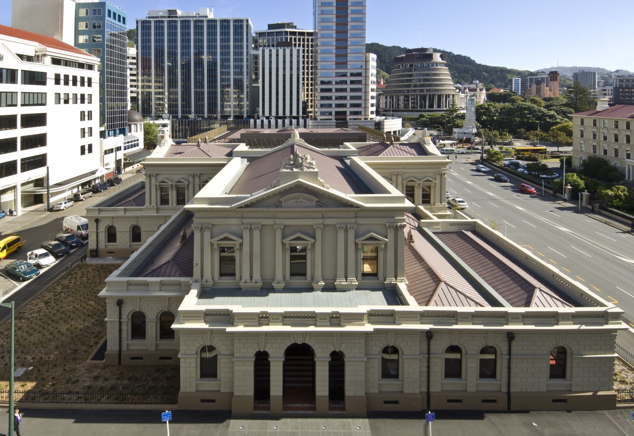 Exterior view of the Supreme Court where the building, city, classical architecture, downtown, facade, landmark, metropolis, metropolitan area, roof, urban area, black, gray