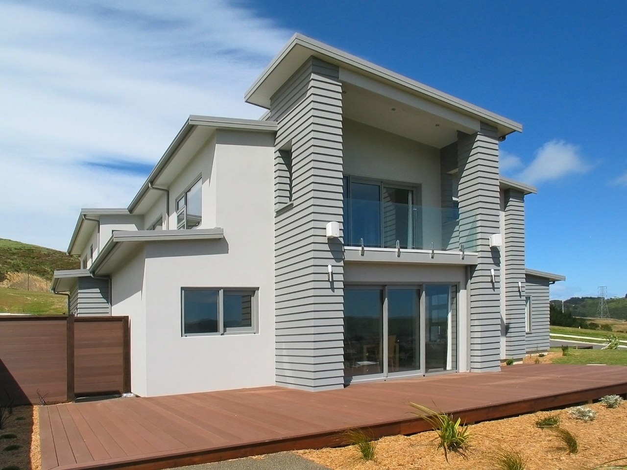 Exterior view of an energy-efficient home designed and building, cottage, elevation, estate, facade, home, house, property, real estate, residential area, siding, villa