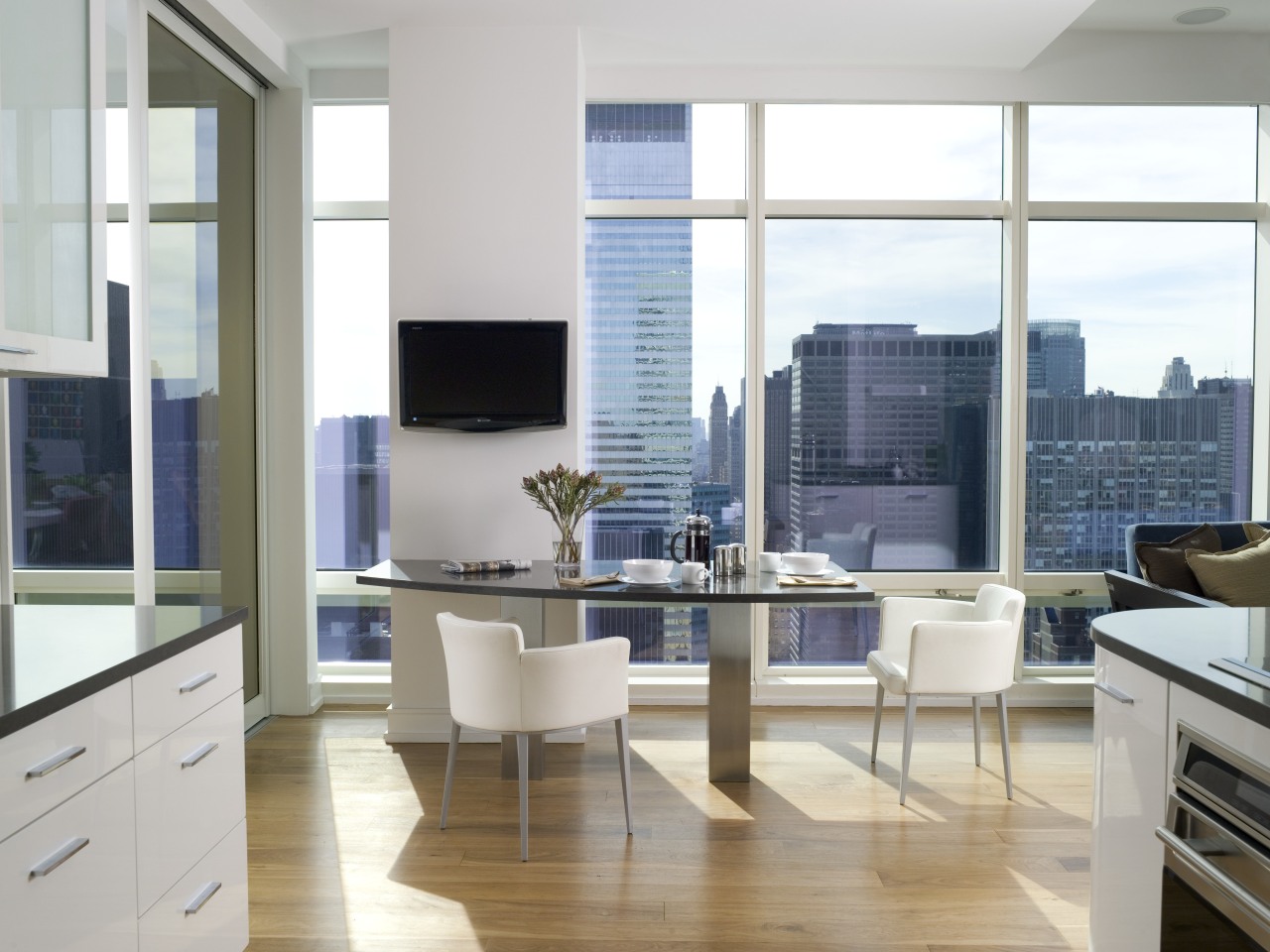 View of contemporary apartment kitchen which features timber floor, furniture, interior design, kitchen, window, white