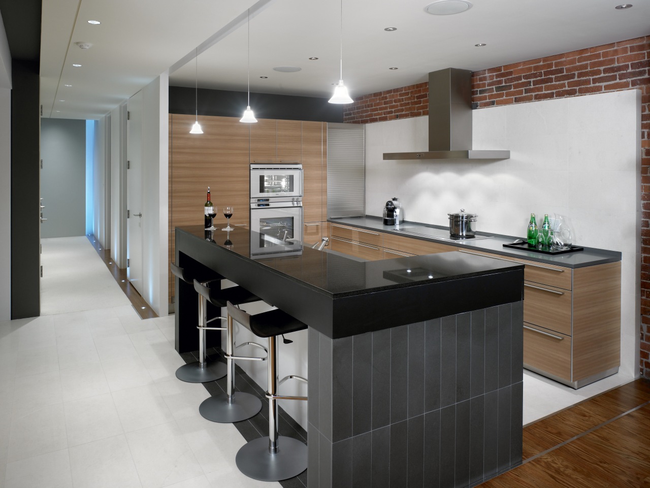 View of a renovated kitchen which features a cabinetry, countertop, floor, interior design, kitchen, room, gray