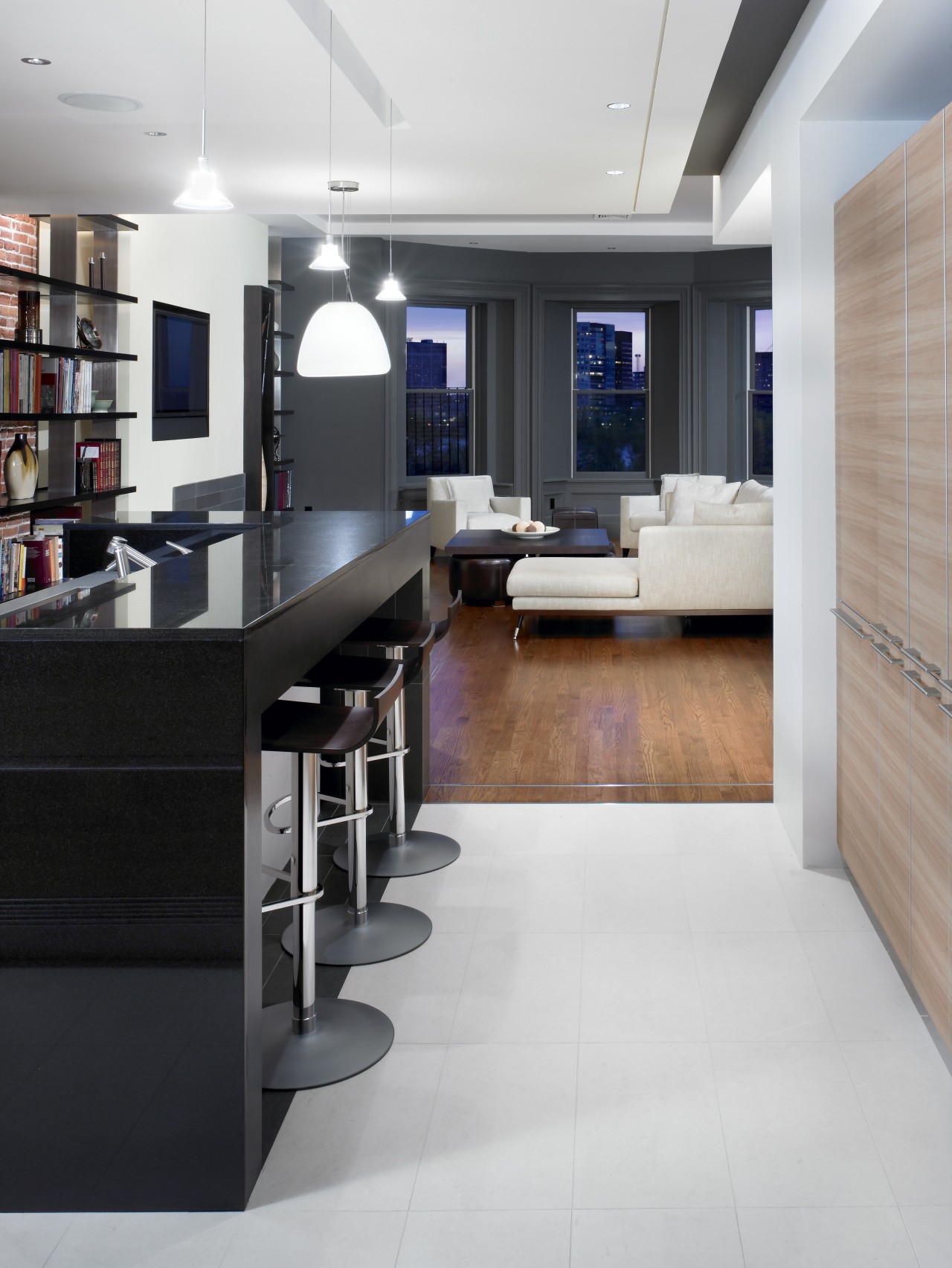 View of a renovated kitchen which features a floor, flooring, furniture, interior design, kitchen, office, wood flooring, gray, black