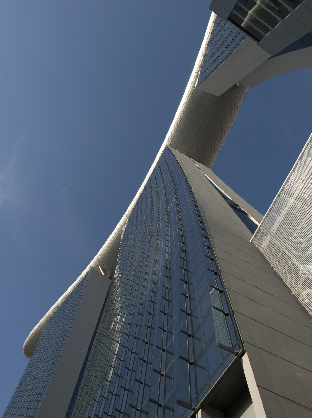 Marina Bay Sands, Singapore angle, architecture, atmosphere of earth, bridge, building, corporate headquarters, daylighting, daytime, facade, fixed link, landmark, line, metropolis, metropolitan area, reflection, sky, skyscraper, structure, tower block, blue