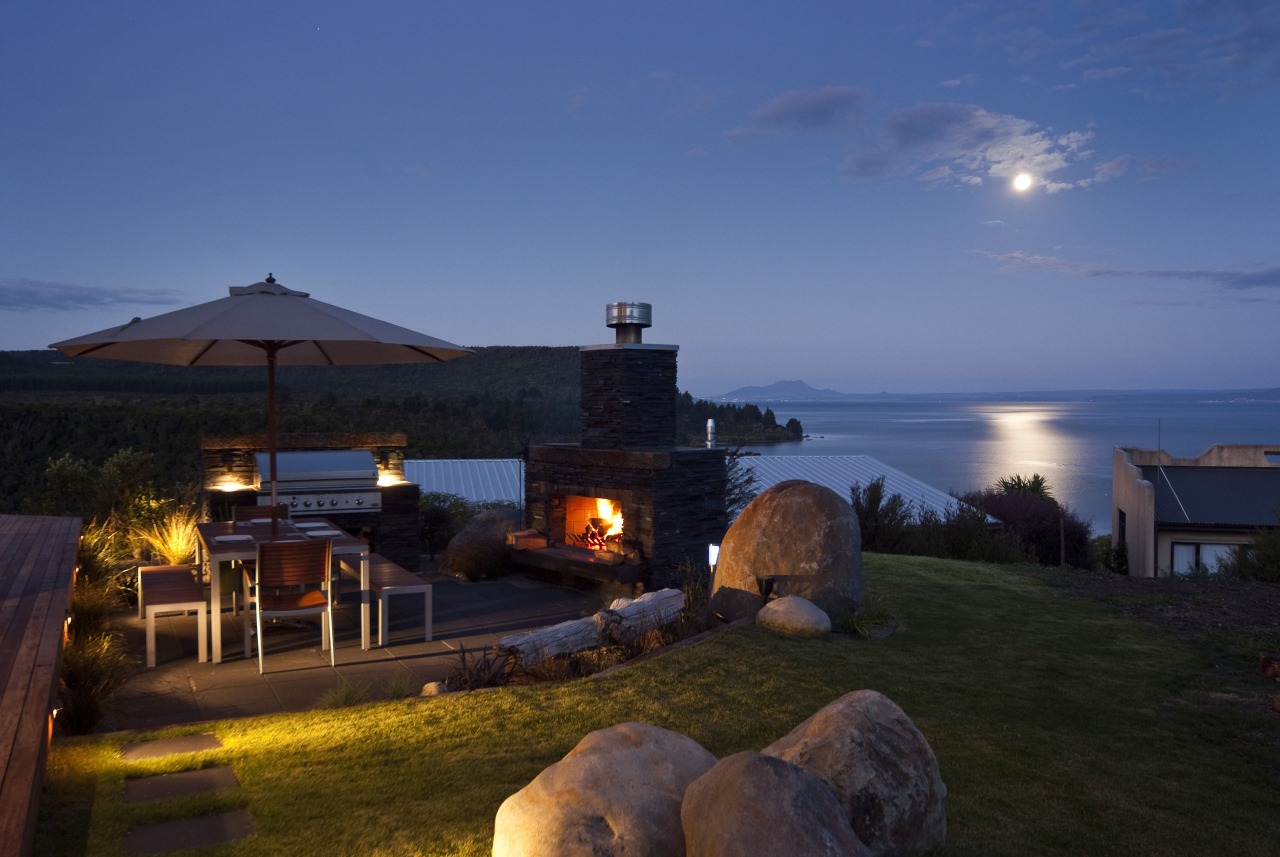 Evening view of the contemporary home cottage, dusk, estate, evening, home, horizon, lighting, property, real estate, resort, sea, sky, villa, blue, black