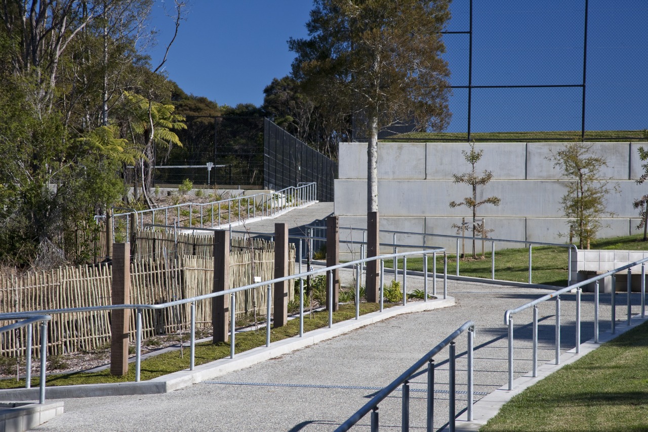 Exterior view of a concrete pathway at Albany architecture, fence, handrail, house, outdoor structure, real estate, structure, tree, gray