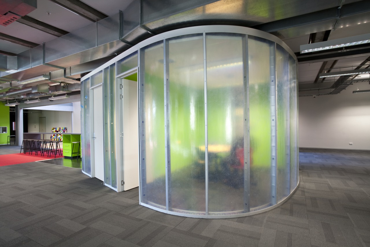 Interior view of this contemporary office features plastic architecture, glass, gray
