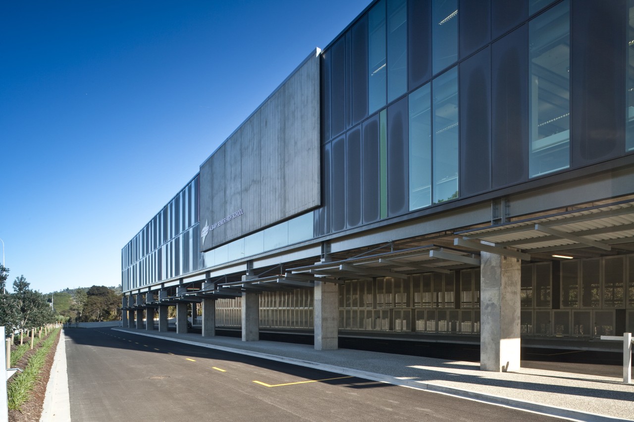 View of the side of this educational building architecture, building, commercial building, corporate headquarters, facade, headquarters, infrastructure, metropolitan area, mixed use, sky, structure, black