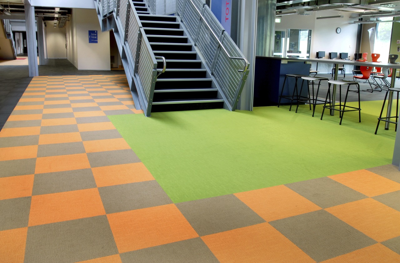 Interior view of the stairway within this educational carpet, floor, flooring, hardwood, leisure centre, tile, wood, wood flooring, orange