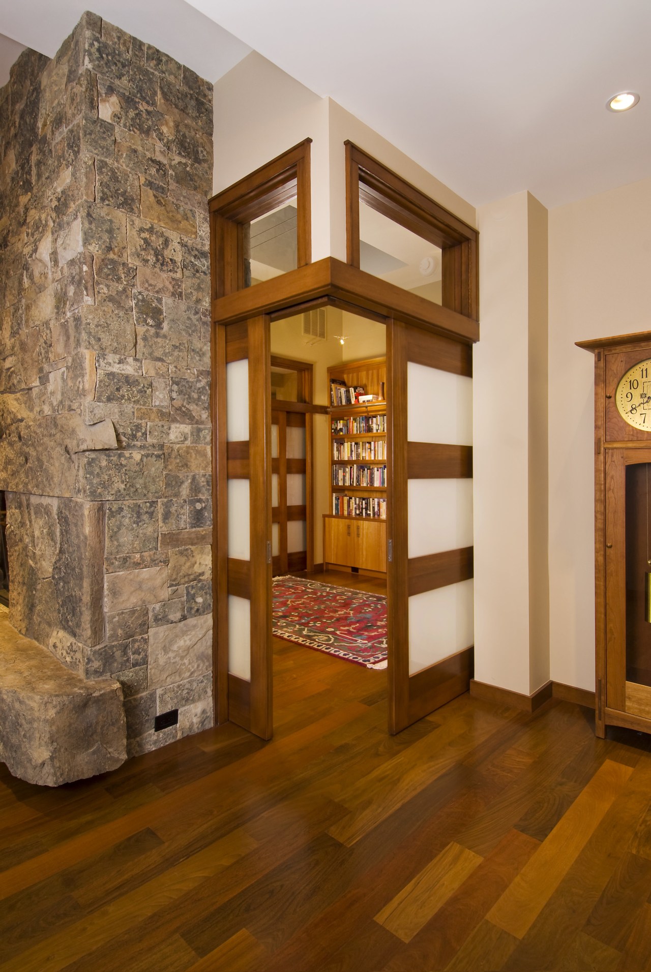 View of this traditional remodeled library space floor, flooring, hardwood, interior design, living room, lobby, wood flooring, brown