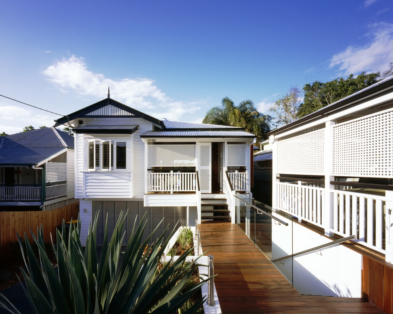 Exterior view of the front of this renovated cottage, estate, facade, home, house, property, real estate, residential area, roof, siding, white