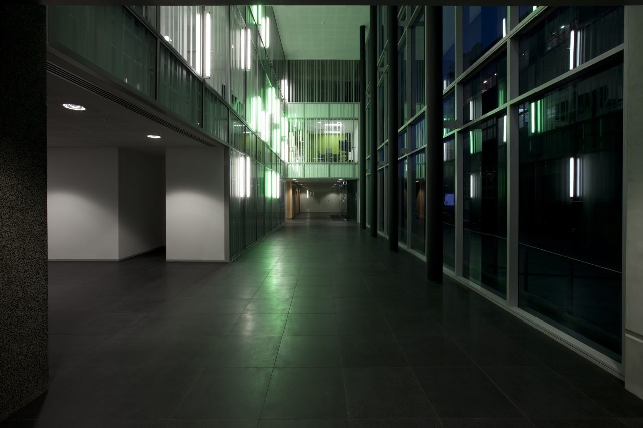 Interior view of the hallway within this modern architecture, darkness, daylighting, glass, light, lighting, metropolitan area, night, structure, black