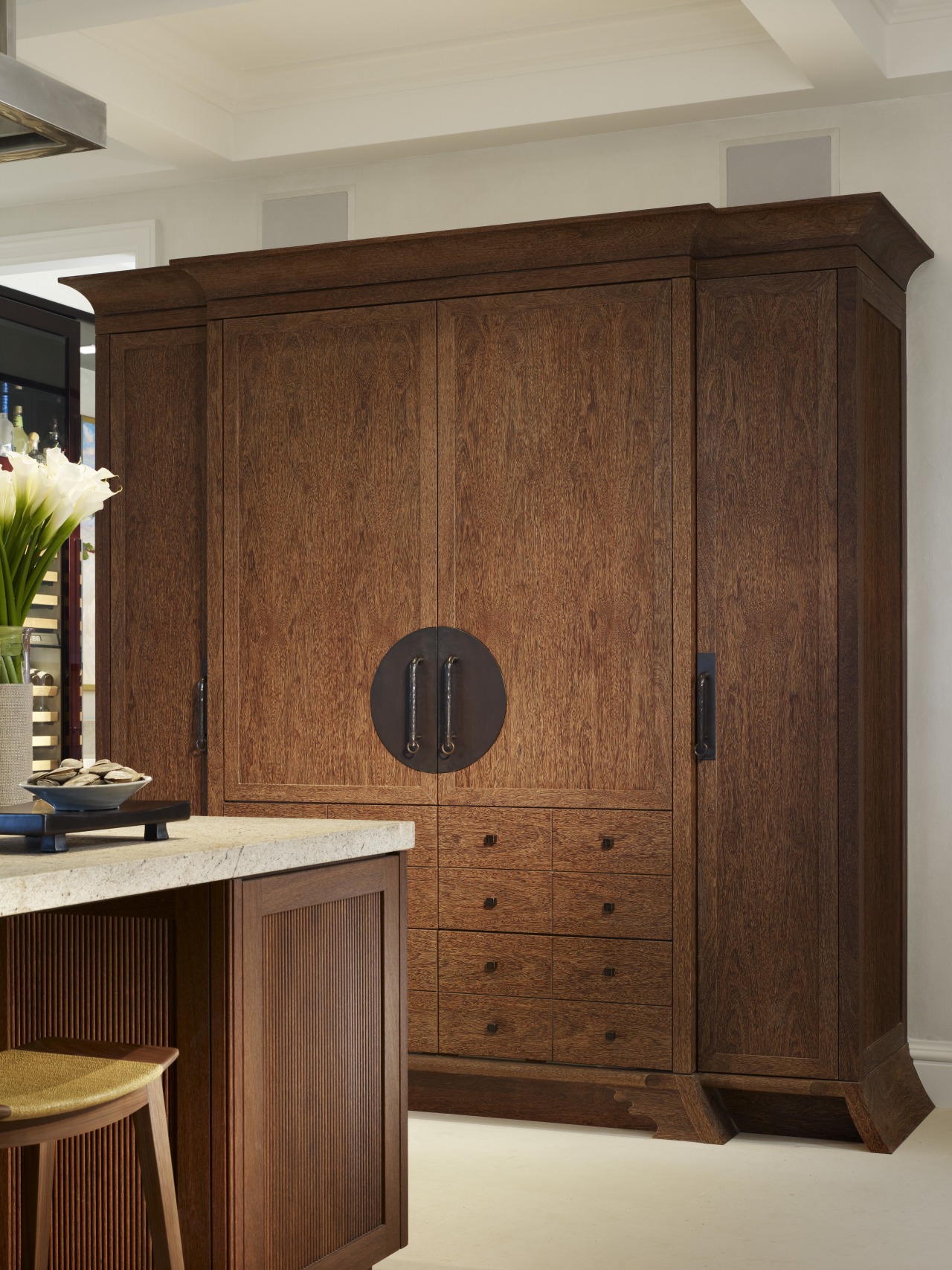 View of a custom refrigerator cabinetry. cabinetry, cupboard, furniture, hardwood, interior design, wardrobe, wood, wood stain, brown, orange