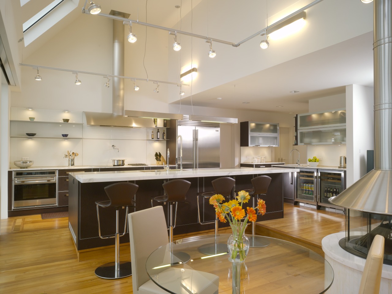 View of contemporary kitchen which features island, stainless apartment, architecture, ceiling, countertop, interior design, kitchen, loft, real estate, gray, brown