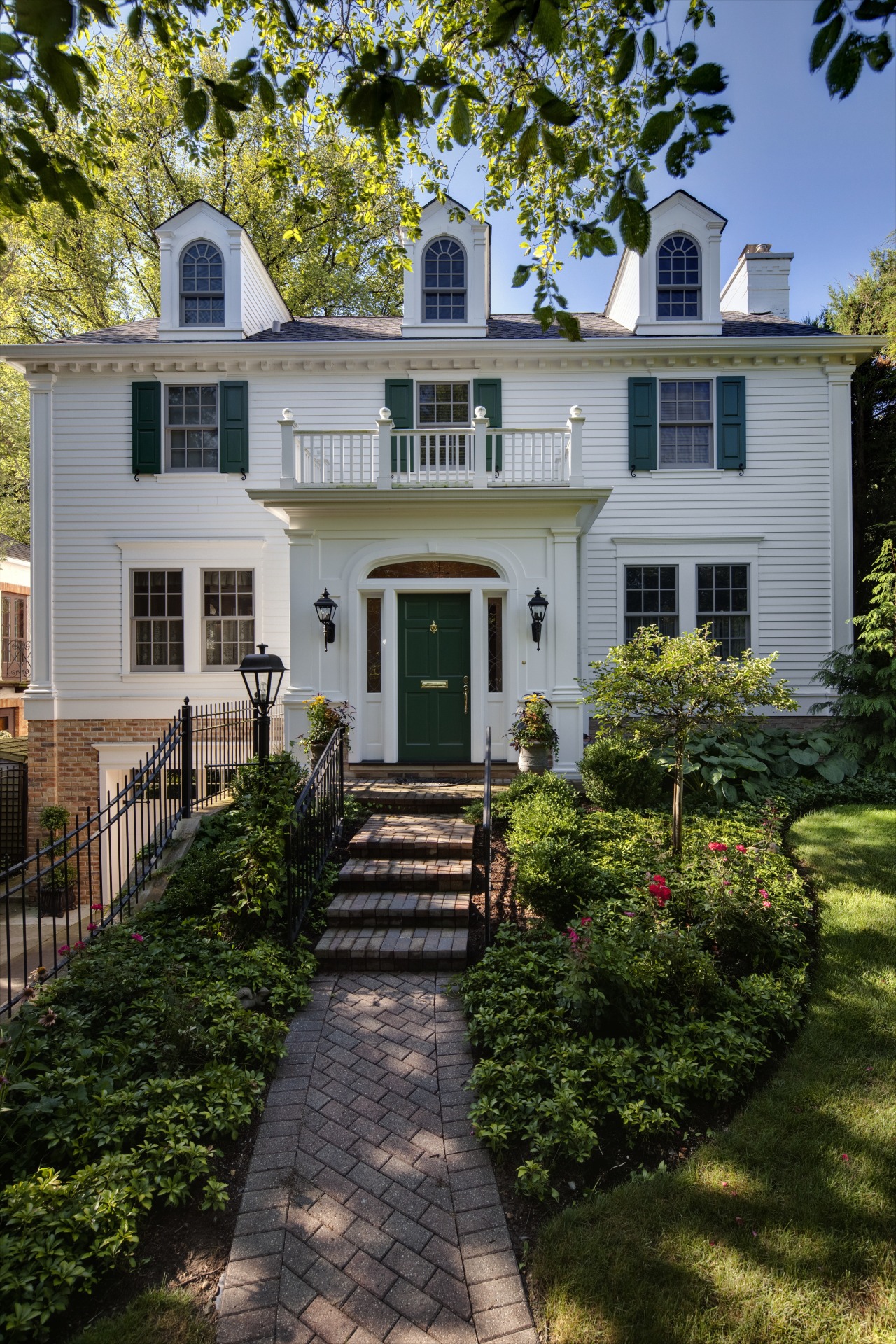 Exterior view of this traditional remodeled home architecture, backyard, cottage, estate, facade, farmhouse, grass, historic house, home, house, landscaping, lawn, mansion, neighbourhood, outdoor structure, porch, property, real estate, residential area, siding, walkway, window, yard, gray