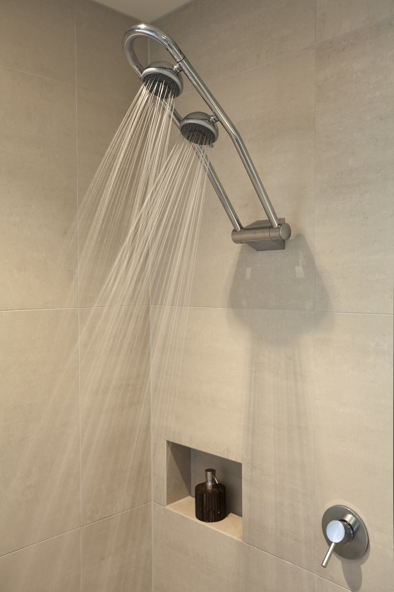 View of renovated bathroom which features glass shower plumbing fixture, product design, shower, tap, orange, brown