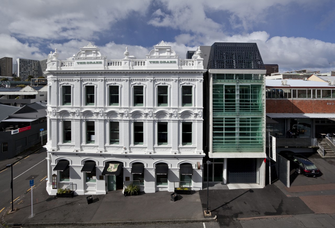 Exterior view of the Drake Hotel which features architecture, building, city, downtown, facade, house, landmark, metropolitan area, roof, window, gray, black