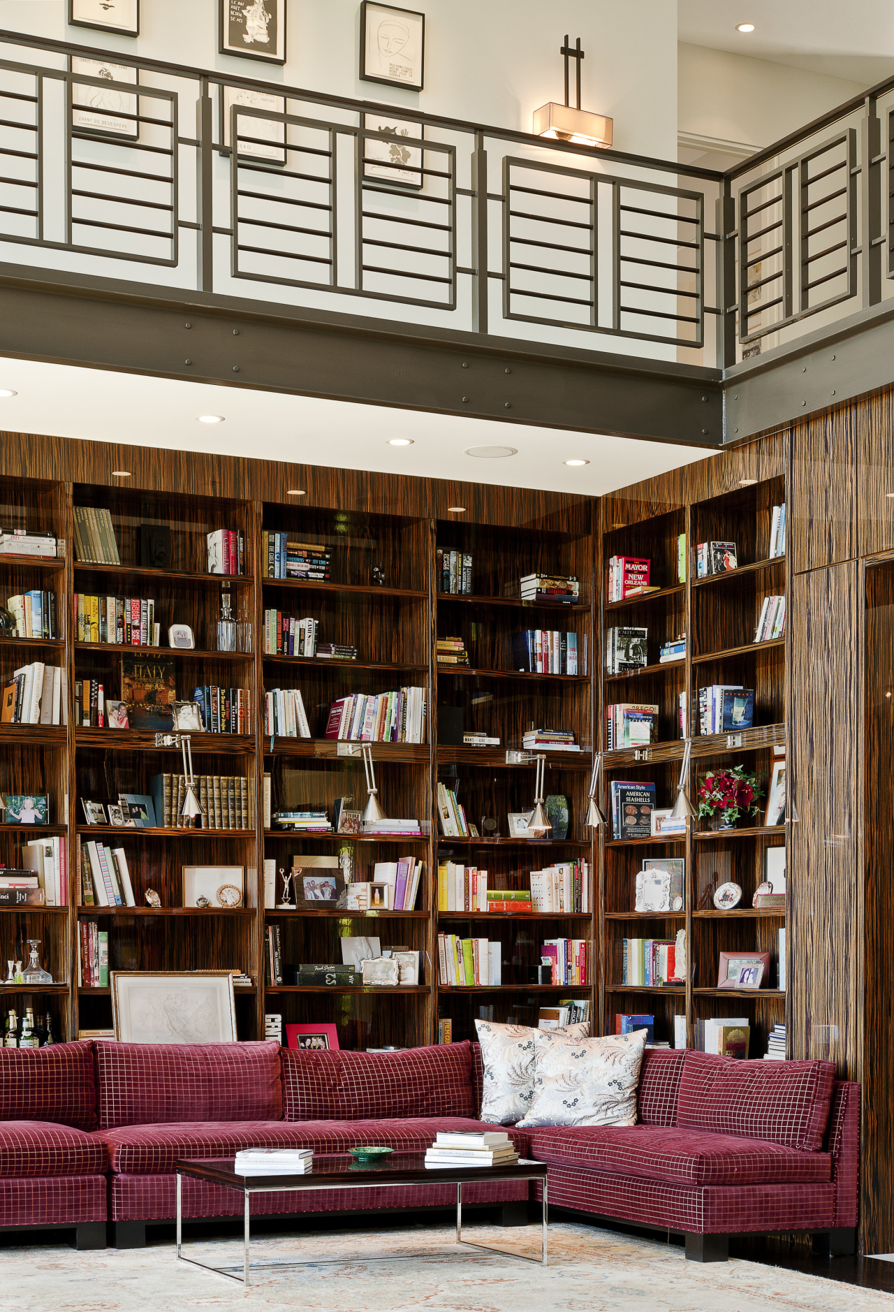 View of the library that features shelving and bookcase, bookselling, furniture, institution, interior design, library, library science, public library, shelf, shelving, white, red