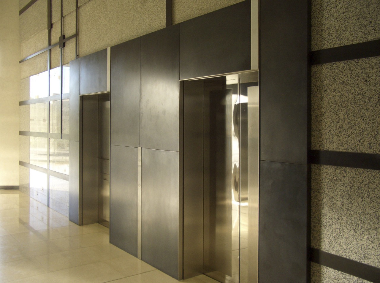 View of brass walls fabricated by Craft Metals door, glass, interior design, lobby, wall, brown